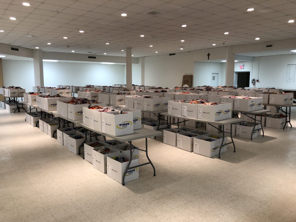 Photo of packed Christmas hampers on tables